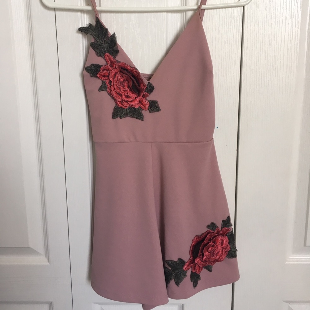 Mauve pink romper with floral accents